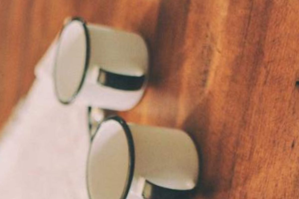 Musicians performing on a lit outdoor stage